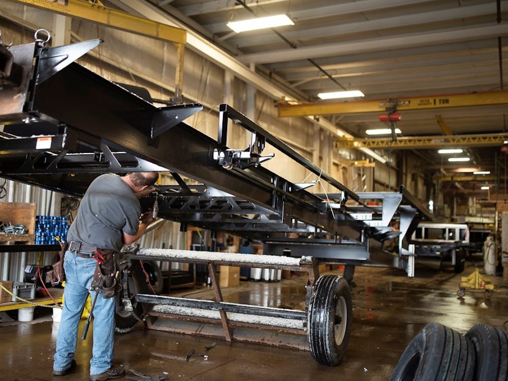 man working on production line in RV factory