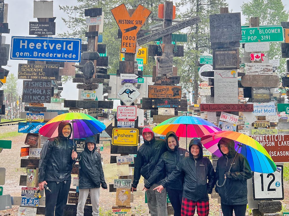 Crazy Family Adventures handing sign at Sign Post Forest
