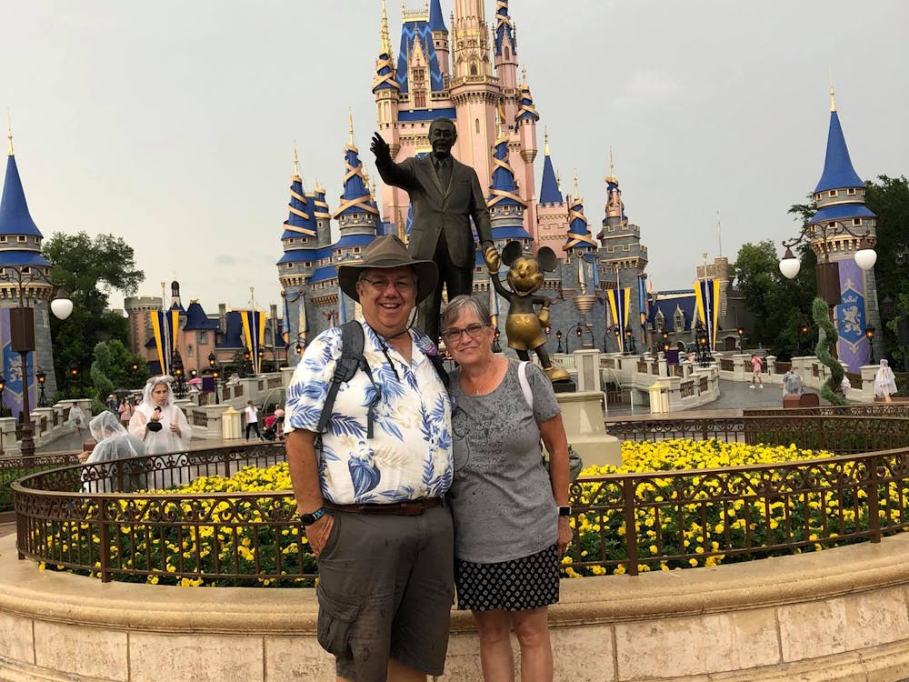 Ambassadors Steve and Dawn standing in front of Disney World Castle