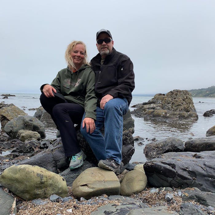Keystone Carbon ambassadors sitting on rocks in front of water