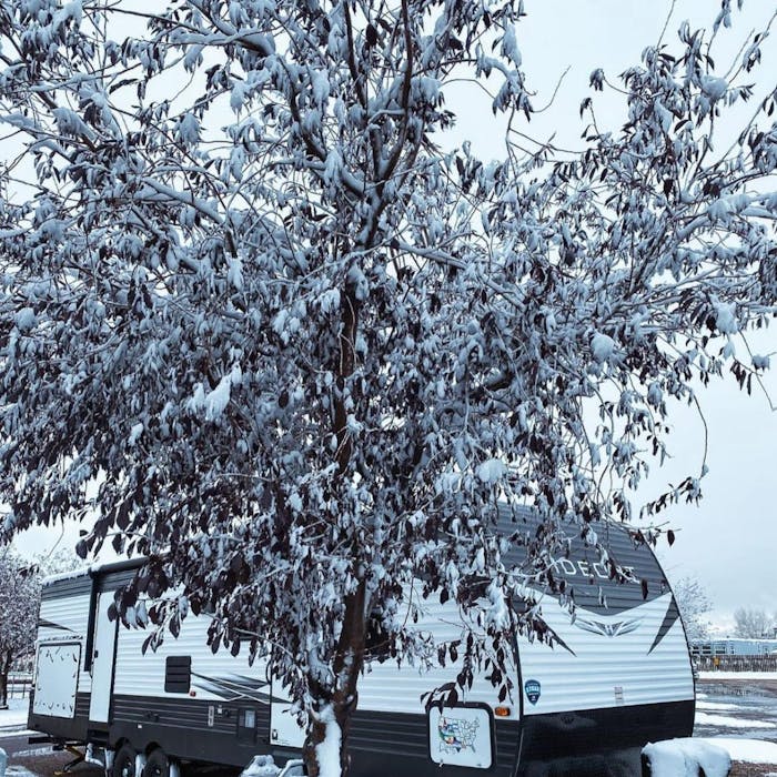 Hideout RV covered in snow in Utah.