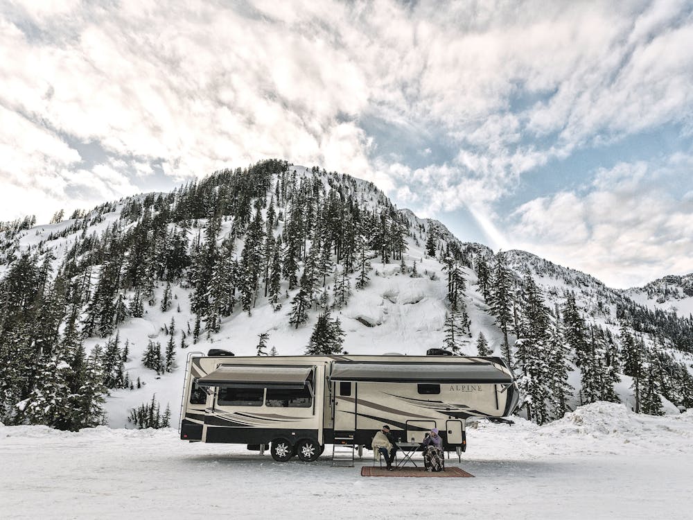 Family camping with snowy background