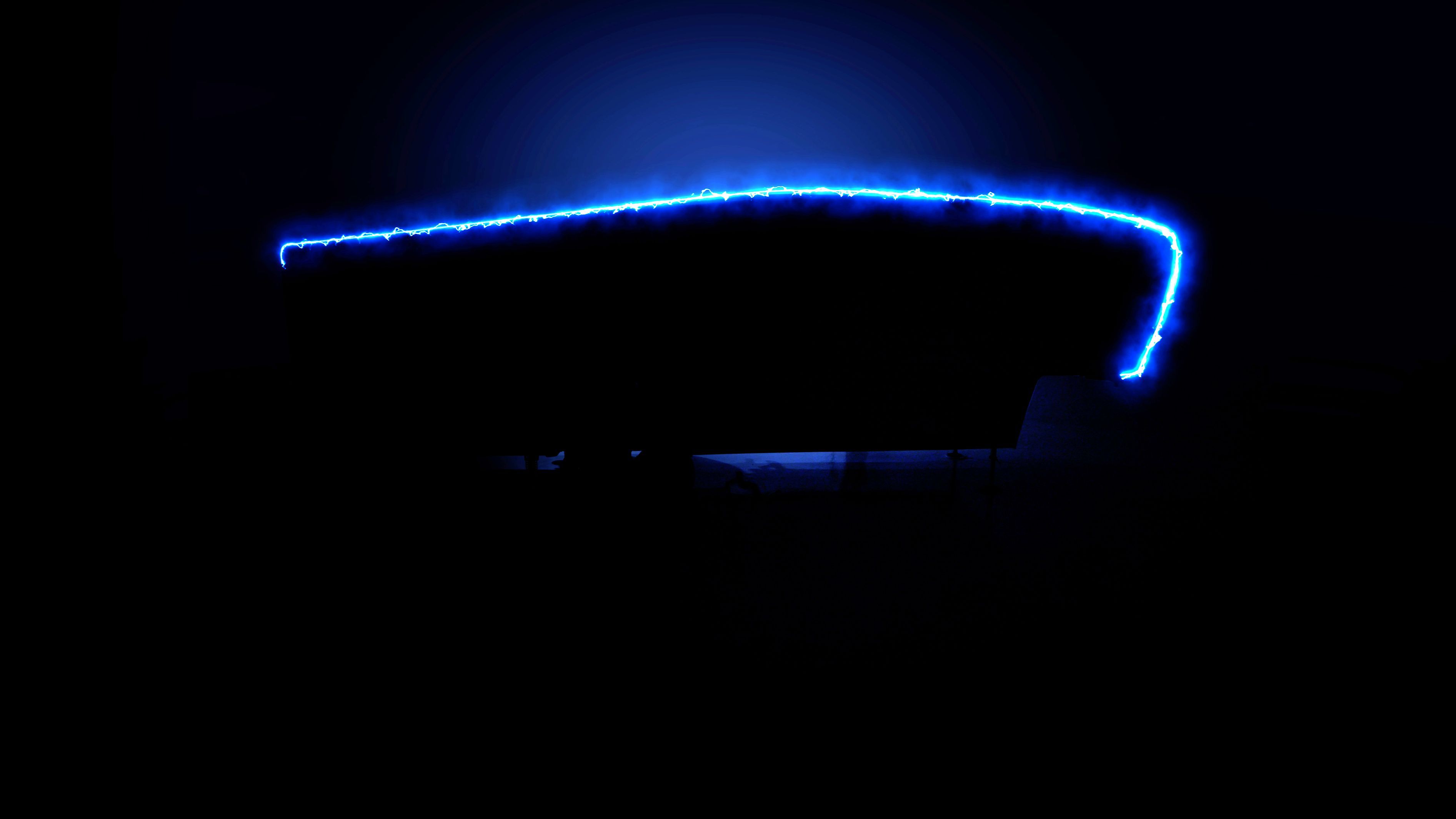 Forward-leaning front cap and arched roofline