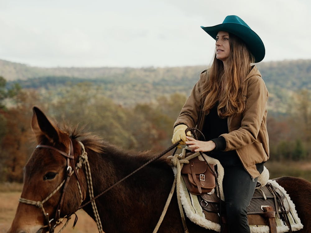 Dawn Olivieri riding rescued Mule on Moon Mountain Sanctuary