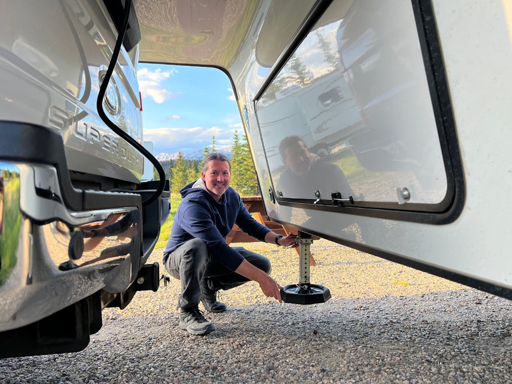 Owner adding the SnapPad accessory to Arcadia RV landing gear