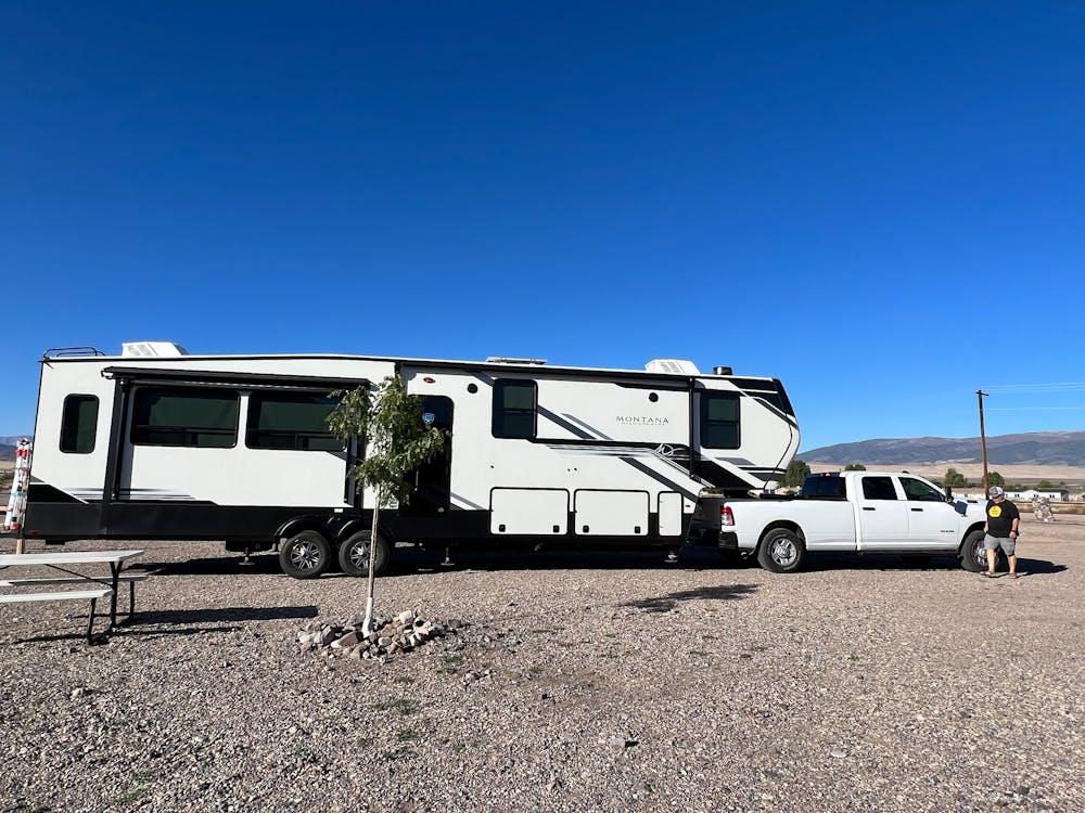 Montana hooked to truck at campground.
