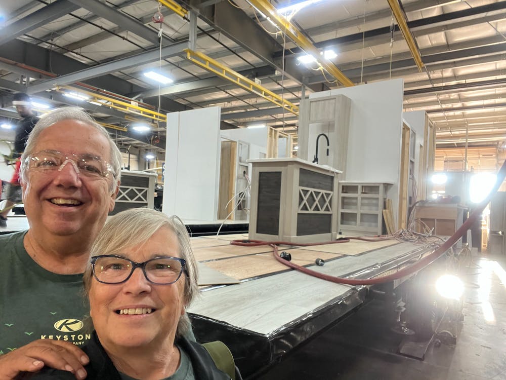 Owners touring their RV being built at factory.
