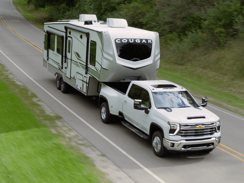 GMC truck towing Cougar