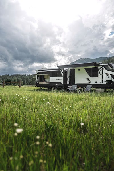 RV in a valley with flowers