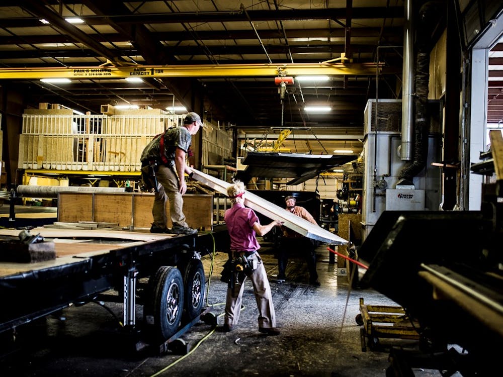 men working in RV factory