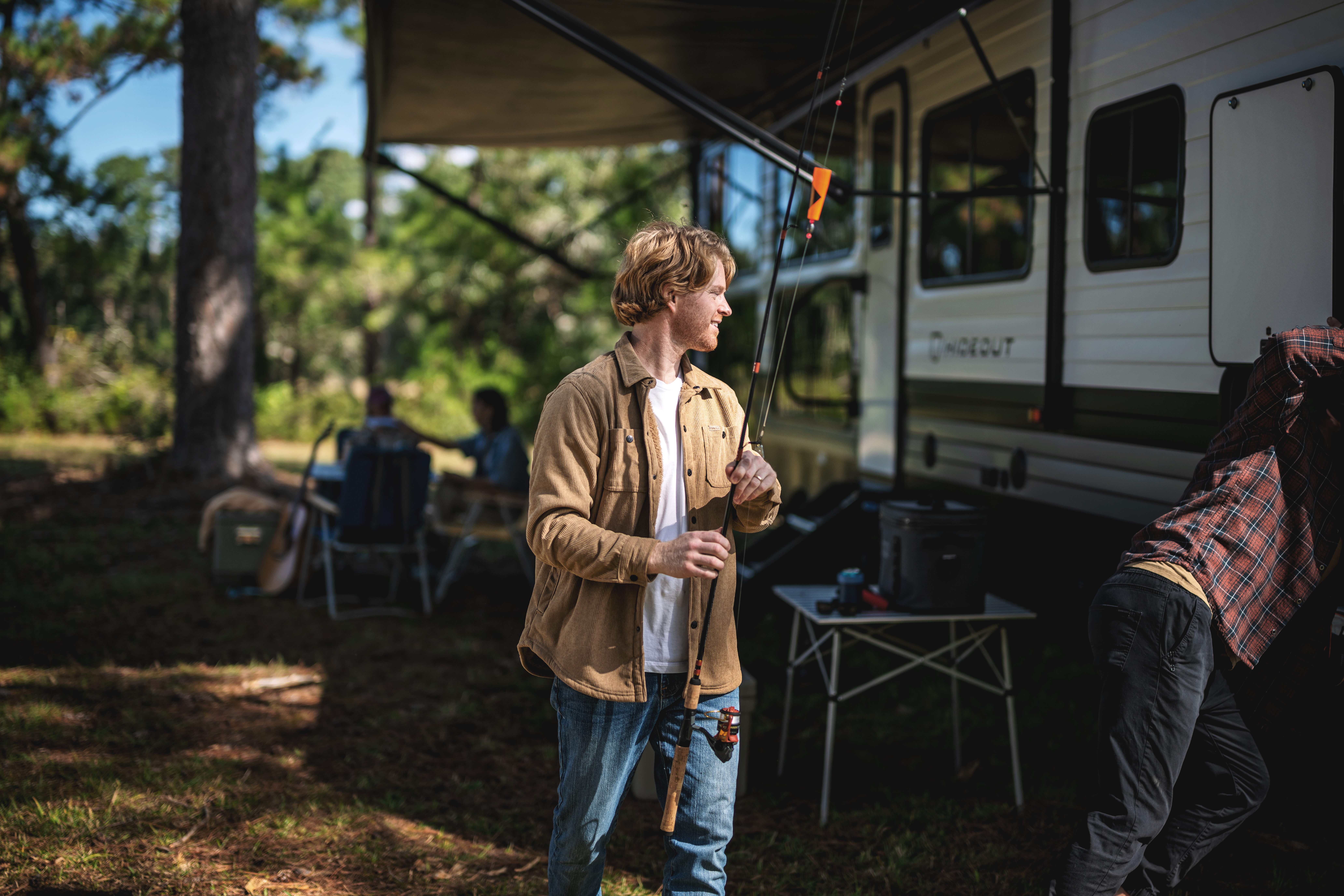 Family setting up campsite