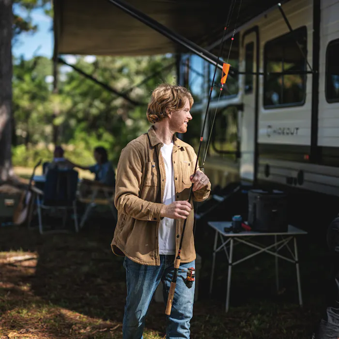 Family setting up campsite