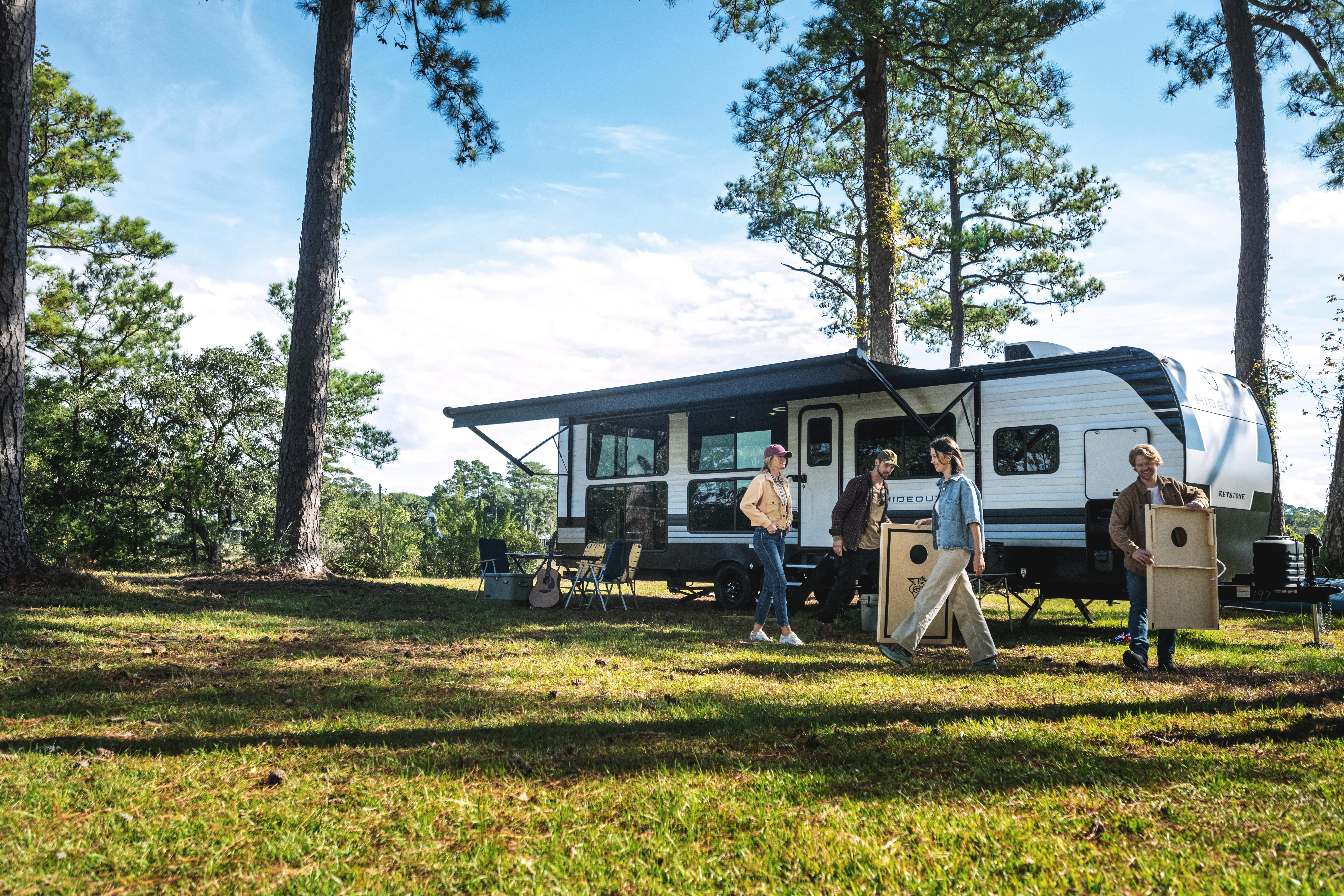 family setting up campsite