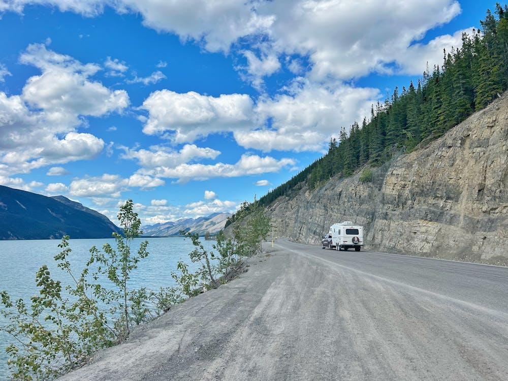 RV driving around Muncho Lake