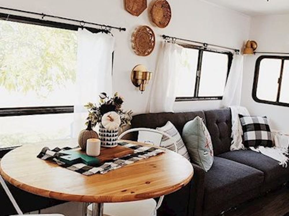 Living area in fifth wheel. White walls, remodeled and customized.