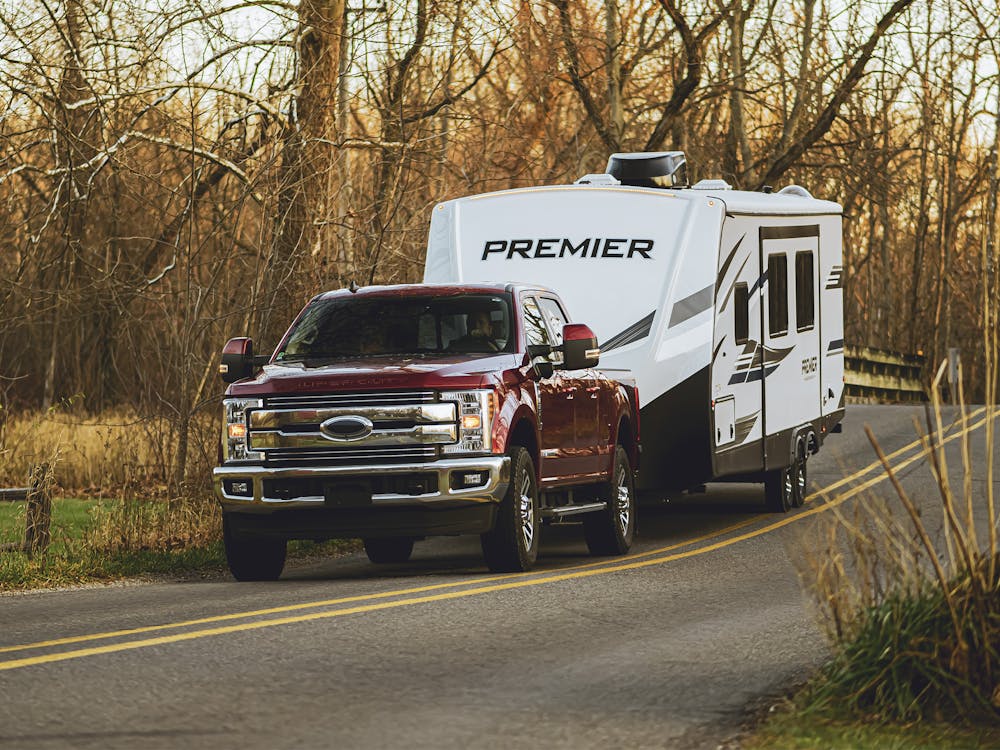 Premier pulled by GMC on the road