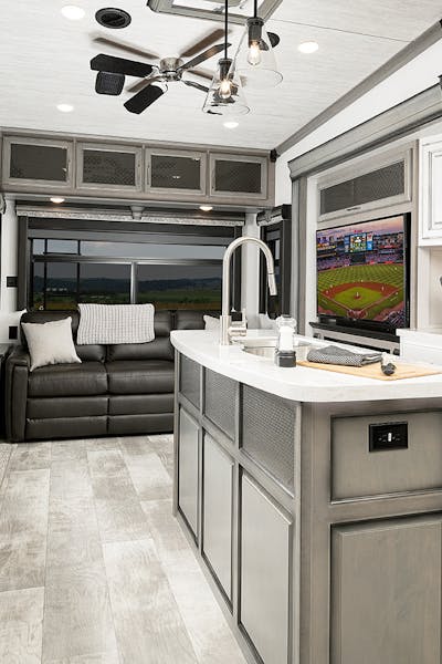 Interior shot of an RV kitchen and living area.